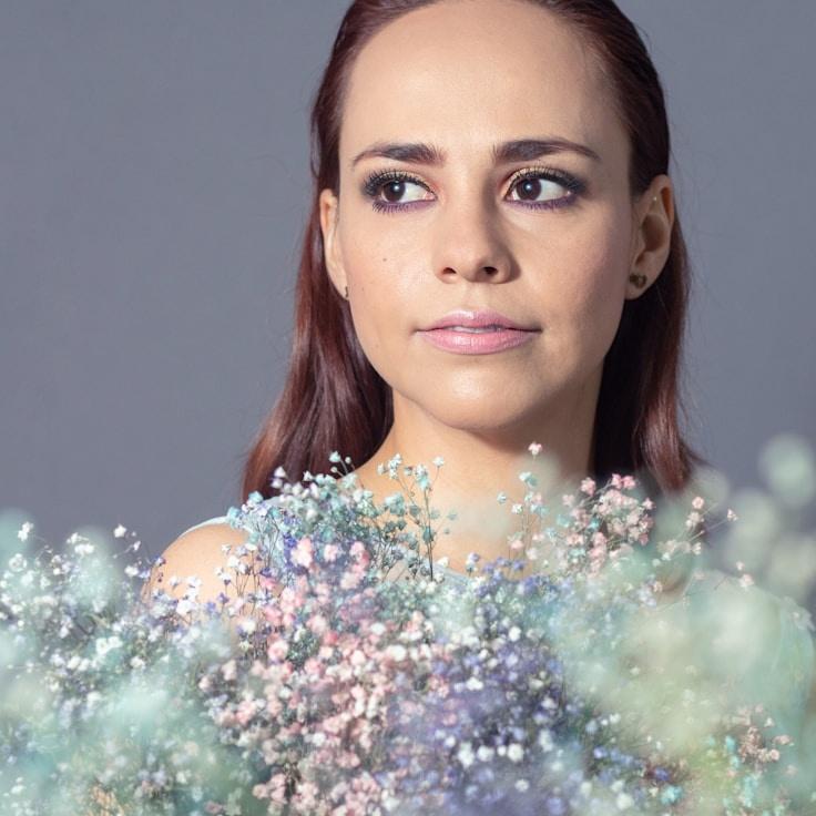 Kaveri Mehta, Lead Design Curator at Lunar Field Canvas, reviewing corporate floral arrangements